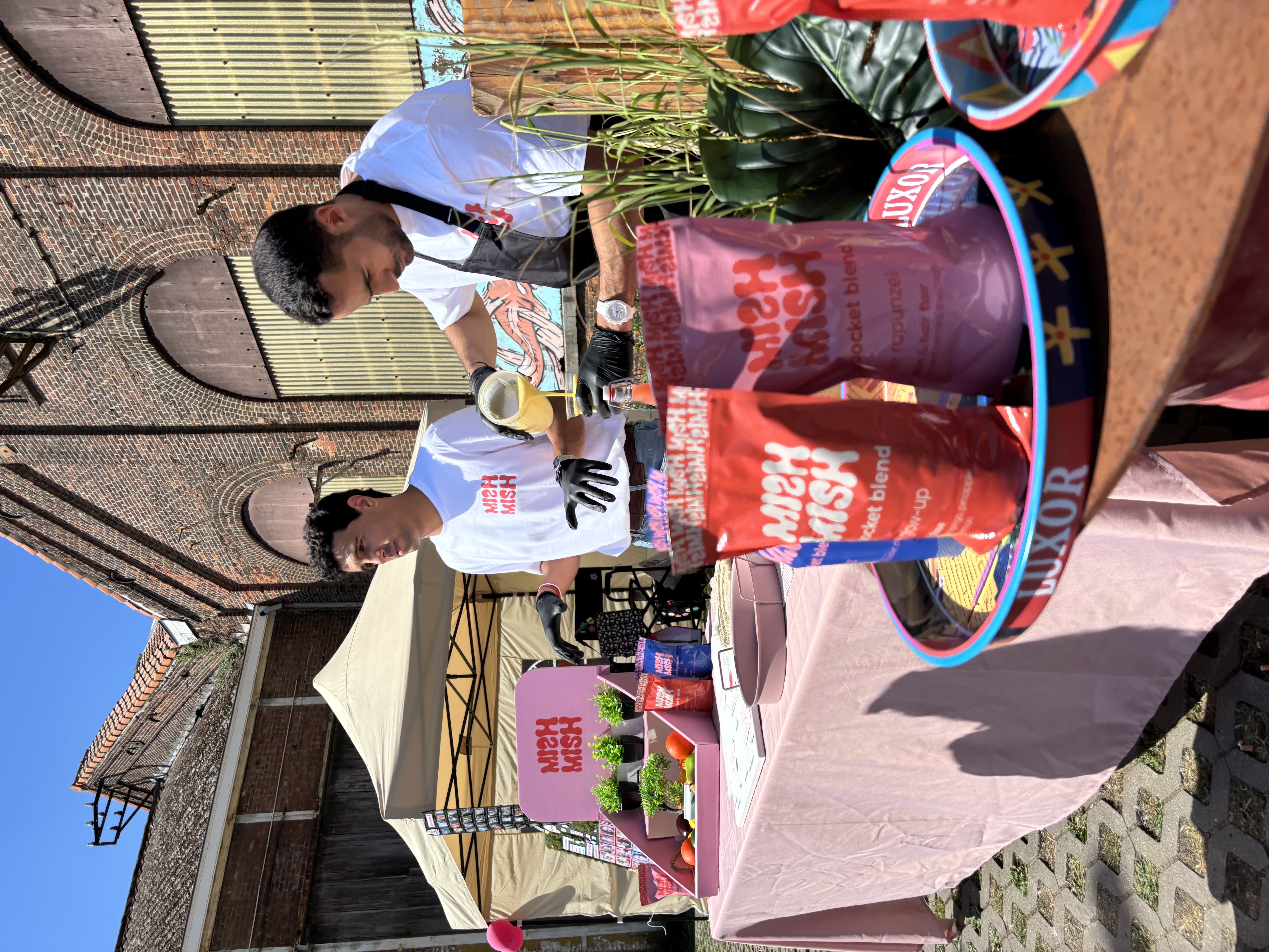 MishMish team pouring smoothies at outdoor event